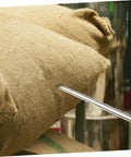 Stainless Steel Grain Sampler Tool With Handy Handle Compact Probe For Corn Rice And Wheat Sampling inserted in burlap sack