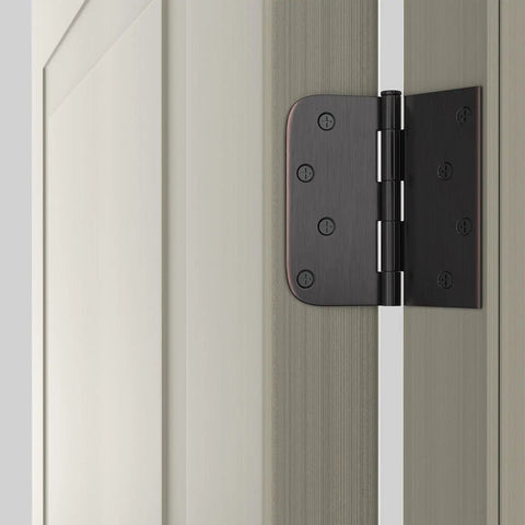 Top Shelf Oil Rubbed Bronze 4X4 Interior And Exterior Door Hinges Smooth Swinging Action Rock Solid Heavy Duty Build Quality With Matching Fasteners Included Dead Simple Install Three Piece Set close-up view on door edge.