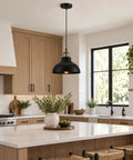 Black Industrial Metal Pendant Light, E26 Curvy Adjustable Ceiling Fixture hanging over a kitchen island with plants.