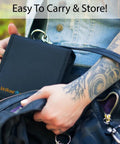 Person placing Compact Sewing Kit For Beginners Portable Travel Essentials into a bag, highlighting easy storage and portability.