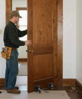Heavy Duty Door Dolly Kit With Wheels For 0 To 2.12 Inch Thick Doors, 2 Piece Adjustable Door Installation Set in use, holding wooden door