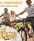 Cyclists riding with Presta To Schrader Bike Valve Adapter Brass Conversion shown; durable brass, compact, portable, leak-proof fit.