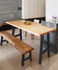 16 Inch Black Iron Table Leg Set Of 2 For Dining Tables supporting a wooden table and bench in a modern kitchen