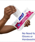 Close-up of hands using Foodservice Surface Sanitizing Wipes Flowpack 7.4 By 9 Inches Durable Thick Wipes 72 Count Pack Of 12.