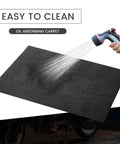 Garage Floor Mat For Oil Spills 29 By 36 Inches Reusable And Washable Oil Absorbent Pad With Waterproof Backing black being washed