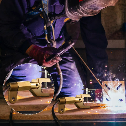 Welder using 600 Amp Welding Ground Clamp, Beefy Solid Brass Grounding Clamp For Heavy Duty Arc Welding, close-up on clamp.