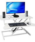 Sit To Stand Computer Desk With Pull Out Keyboard Tray Ergonomic Office Workstation featuring sleek white design, keyboard, and monitor setup.