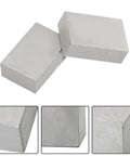 Two 1x2x3 inch steel machinist blocks with no holes for layout and grinding.