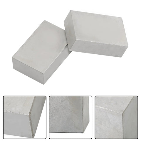 Two 1x2x3 inch steel machinist blocks with no holes for layout and grinding.