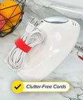 A kitchen appliance with a cord secured by a red strap from the Self-Gripping Cable Ties Set, Multi-Color 40 Pack, Reusable Hook And Loop Cable Wraps For Cord Management, Home Office Desk Organization, 5 Inch And 8 Inch Straps, Keeps Cables Neat And No More Cable Chaos.