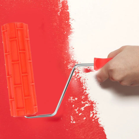 Top Shelf Rubber Textured Paint Roller With Kick Butt Spiked Surface For Walls Floors And Furniture Refinishing creating patterns on red wall.