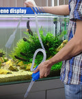 Person using Gasoline Siphon Pump Kit 5.84 Ft Portable Manual Fuel Transfer Pump With Siphon Hose for aquarium refilling in home