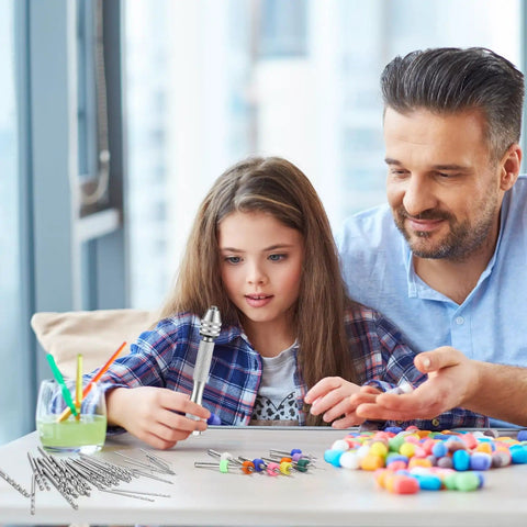 Father and daughter using 59 Piece Hand Drill Bits Set With Pin Vise And Micro Twist Bits Including 10 Tungsten Carbide Bits for crafts.