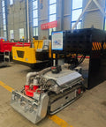 Remote Controlled Pond Dredger With Tracks For Easy Sludge Cleanup in Farm Fish Ponds and Lakes, displayed in factory setting.