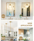 Gold Finish Industrial Pendant Light With Clear Glass Globe Shade in bathroom, dining room, and kitchen settings