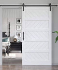 White Five Panel Barn Door With 7 Foot Track Kit Included 42 By 84 Inch Solid MDF Wood Slab Covered With Waterproof Scratch Resistant PVC Surface DIY Assembly And Easy Install, installed in room.