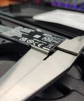Close-up of a Top Notch 6 Inch Digital Caliper With 0.0005 Inch Resolution and 0.01 mm on black case, stainless steel vernier.