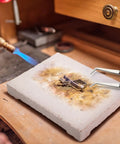 Six Piece Jewelry Soldering Kit With Ceramic Honeycomb Boards Copper Tong Solder Plate And Three Lock Tweezers on workbench