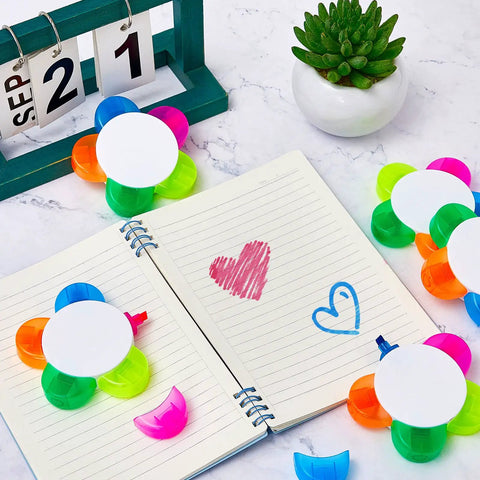 Petals Highlighters Set 140 Pieces In Five Assorted Fluorescent Colors shown with open notebook and calendar
