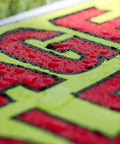 Close-up view of a wet sign from Garage Sale Sign Kit With Three Large Signs And Three 11 By 14 Signs One Thousand Two Hundred Colorful Price Stickers In Yellow Pink And Green Plus Twenty Large Pricing Cards Ultra Bright And USA Made For Quick High Visibility Sales.