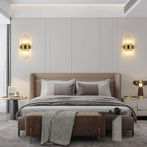 Gold Crystal Wall Sconce With Modern Vibe, Sleek Glass Rods And Stainless Steel Base on bedroom wall, set of two beside bed.