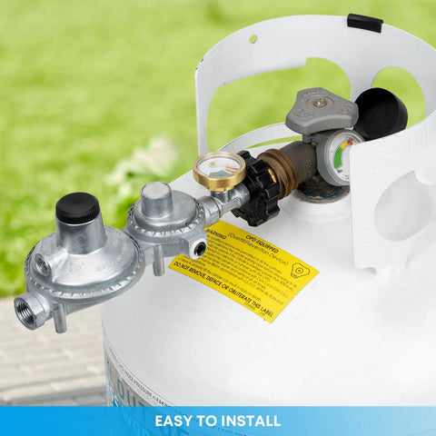 Side view of Stanbroil two-stage propane regulator with gauge on a white LP tank; P.O.L and 3/8 in. NPT fittings