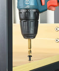 Number Eight By Three Quarters Inch Self Tapping Pan Head Wood Screws With Phillips Drive and Black Oxide Finish being used with a drill.