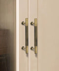 Antique Brass Cabinet Pulls 5 Pack Solid Brass Dresser Drawer Handles 3-3/4 Inch Center To Center installed on modern cabinet doors.