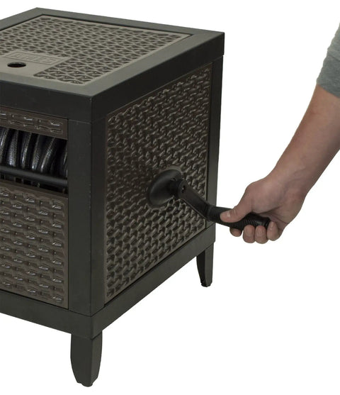 Person using NeverLeak Hose Reel Cabinet With 100 Ft Capacity, Decorative Wicker Look, Auto Track Rewind, Black Metal Outdoor Hose Storage Box for Yard, Patio Or Deck Keeps Hoses Looking Slick And Stylish with handle