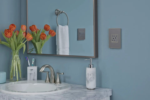 Tamper Resistant GFCI Outlet With Auto Self Test Every Three Seconds, 20 Amp Magnesium Finish in bathroom setting