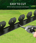 Close-up of cutting 33 Foot Plastic Landscape Edging Border Kit With 4 Inch High Panels 45 Ground Stakes And Hammer Included