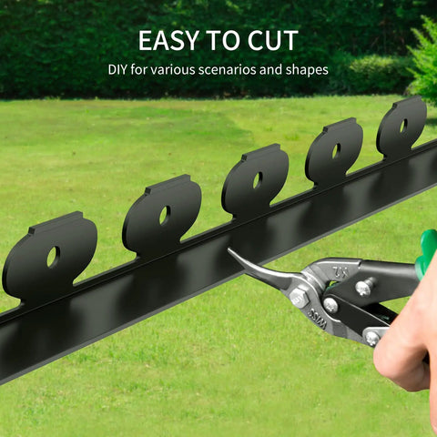 Close-up of cutting 33 Foot Plastic Landscape Edging Border Kit With 4 Inch High Panels 45 Ground Stakes And Hammer Included