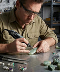 Man using rotary tool with 30 piece diamond burr set for jewelry making, ideal for stone, ceramic, glass, tile, and more.