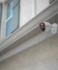 Add On 4K Security Bullet Cam With Flashing Lights And Sensor Spotlight For Indoor Or Outdoor Use, mounted on building exterior