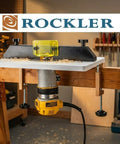 Pro Grade Adjustable Trim Router Table For Woodworking, high visibility bit guard, mounted on a workbench, in workshop