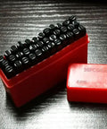 Four Millimeter Steel Die Stamp Kit with 36 Pc Number and Letter Punch Set in hardened metal case included, showing stamps in red case