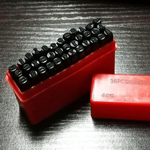 Four Millimeter Steel Die Stamp Kit with 36 Pc Number and Letter Punch Set in hardened metal case included, showing stamps in red case