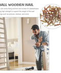 Man examining Drywall Anchors and Screws Kit 40 Sets Heavy Duty Rust Proof Steel Construction for Concrete and Dry Walls