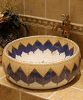 Sleek Mediterranean Ceramic Vessel Sink Built For Modern Countertop Setups, round glossy basin with blue and gold design.