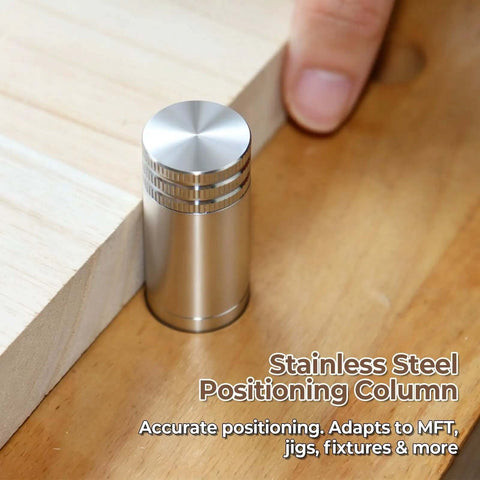 Pro Grade 20mm Bench Dogs Set With 38mm Rise For MFT Workbench next to wooden surface, stainless steel finish