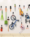 Heavy Duty Garage Hooks 10 Pack Steel Wall Mount Tool Hangers for organizing ladders, tools, and gear on a garage wall.