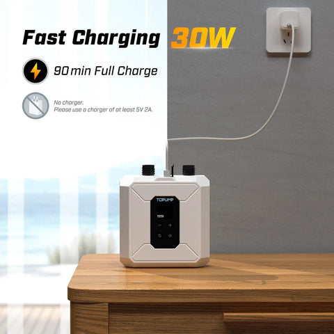 Cordless Electric Paddle Board Pump with Auto Off and Dual Stage Inflation, charging on a wooden table for SUPs, 20 PSI