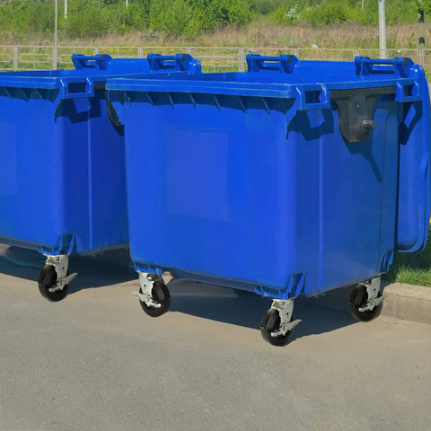 Blue industrial waste bins with heavy duty 6 inch rubber on cast iron caster wheels for carts furniture and workbenches.