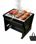 Compact Foldable Charcoal Grill For 1 To 2 People, Tabletop BBQ Cooker For Outdoor Camping with skewers and carry bag shown.