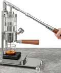 Portable Hand Pressed Espresso Maker With A Solid Wood Handle And Premium Stainless Steel Body brews espresso with a walnut handle and steel body.