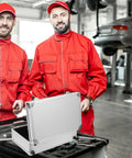 Two mechanics in red coveralls with a Badass Heavy Duty Aluminum Alloy Tool Box With Reinforced Carry Handle And Secure Latch System.