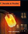 Heavy Duty 12 Gauge Outdoor Extension Cord 10ft With Lighted End 15A 1875W Black lighted plug on wooden fence at night