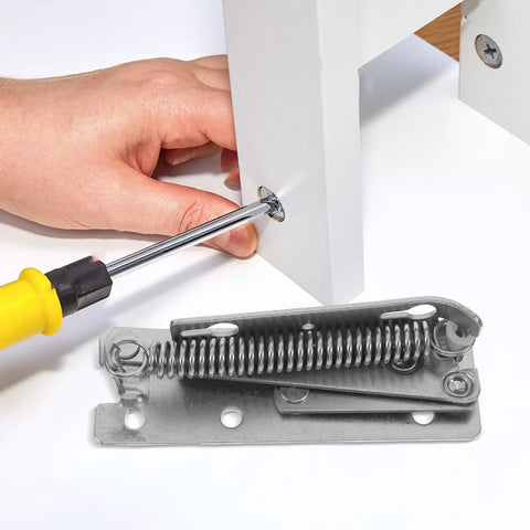 Heavy Duty 90 Degree Folding Scissor Spring Hinge for Cabinet Doors and Sofas in steel construction being installed with a screwdriver.