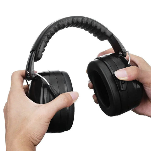 Hands holding Top Notch Hearing Protection Earmuffs with Adjustable Headband and Swivel Cups, Black