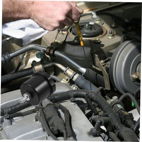 Mechanic checking engine oil next to Aluminum Brake Fluid Reservoir Drift Oil Tank For Cars High Performance Car Brake Oil Cup With Sleek Design Durable Aluminum Alloy Easy Install Keeps Brakes Quiet And Responsive For Street And Track Use in car engine compartment.